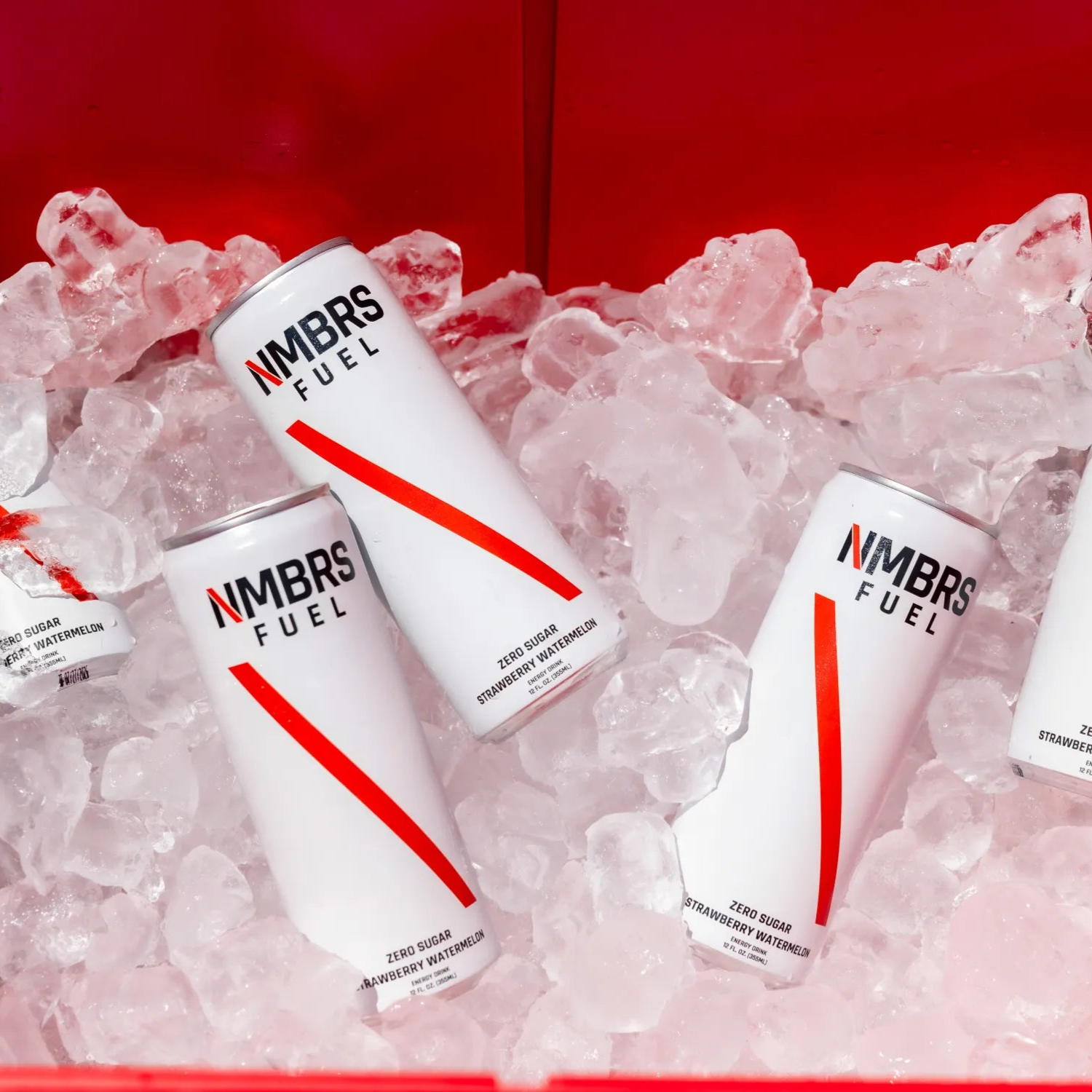 NMBRS Fuel energy drinks on ice with a red background